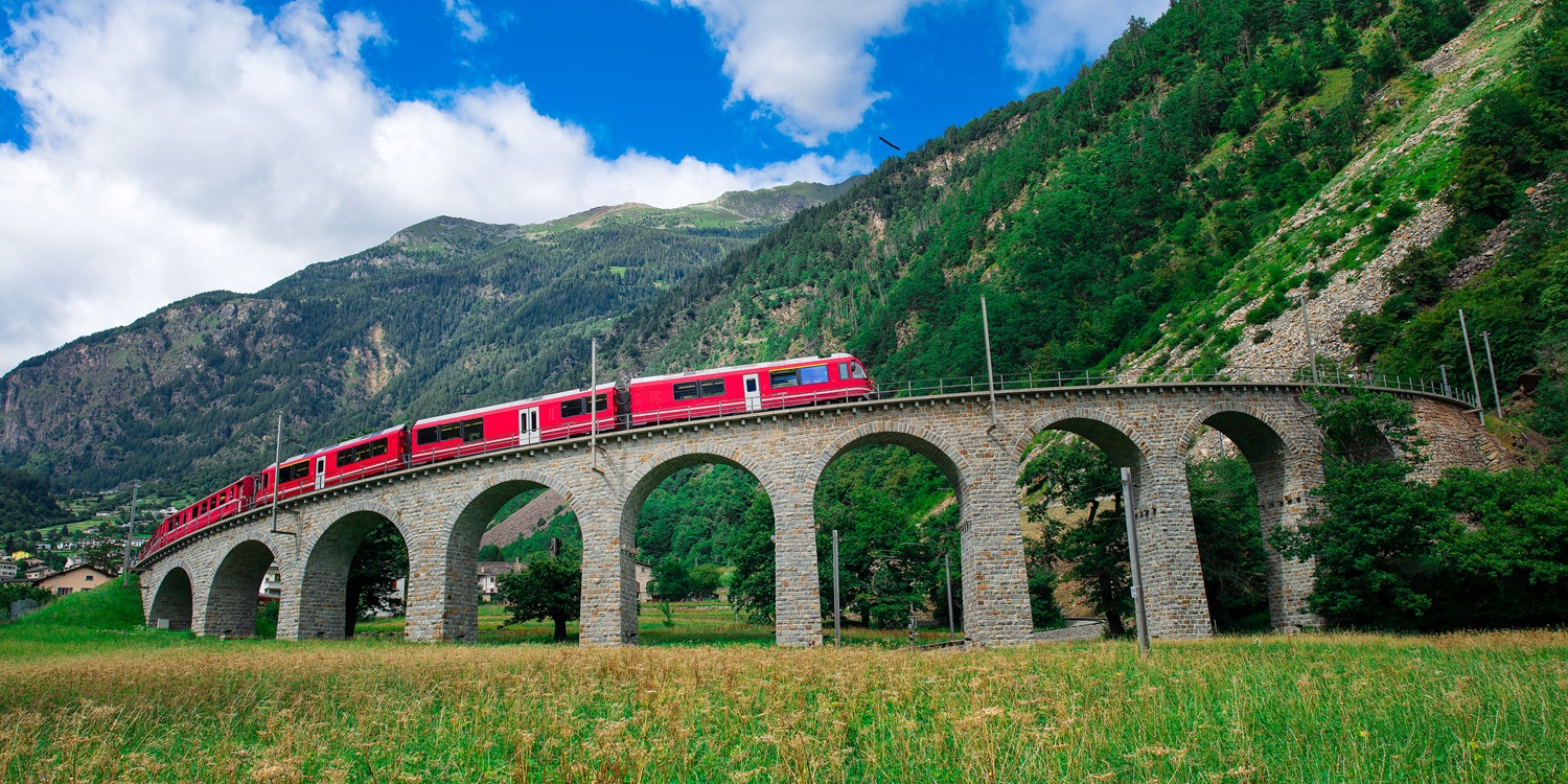 Swiss mountain train Bernina Express Cross the bridge in the cir