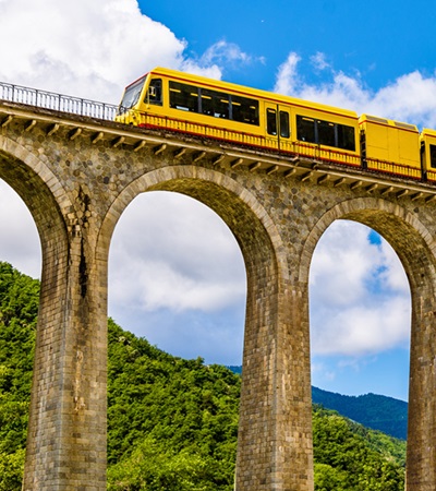 Eurail/Interrail Global Pass - The Yellow Train (Train Jaune) on Sejourne bridge - France, Pyrenees-Orientales