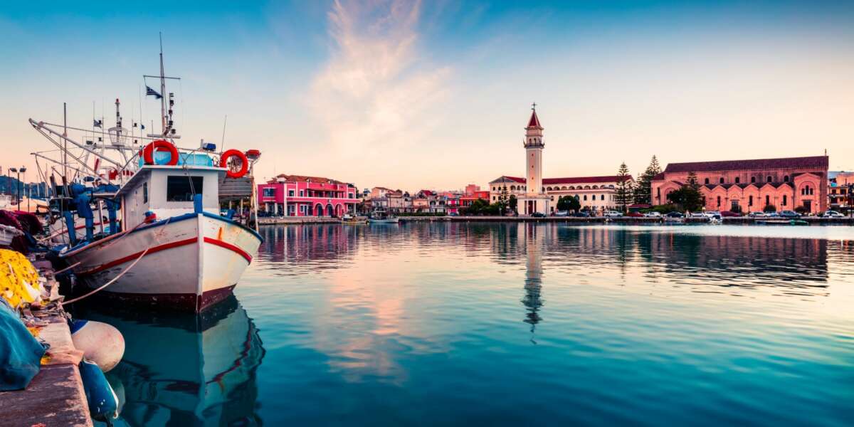 Picturesque spring sunset in the Zakynthos city. Great evening view of the town hall and Saint Dionysios Church, Ionian Sea, Zakynthos island, Greece, ...