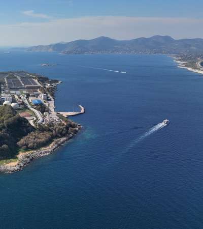 Aerial drone photo of small industrial island of Psitaleia the largest sewage treatment plant in Europe, Saronic gulf, Peiraeus, Attica, Greece