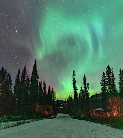 Fantastic display of northern lights with stunning green & purple bands, swirls and spears. Taken in Yukon Territory, northern Canada.