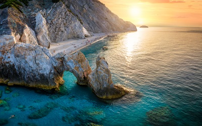 Aerial view of the beautiful Lalaria beach at Skiathos Island, Sporades, Greece, during golden summer sunset time