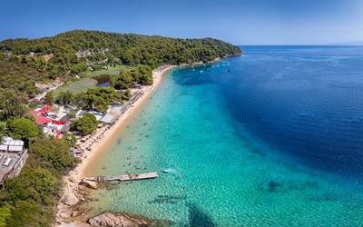 Aerial view of the popular Vromolimnos beach at Skiathos island, Sporades, Greece, with turquoise sea